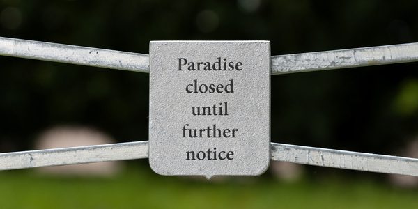 A sign that says paradise closed until further notice.