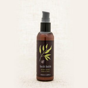 A bottle of body lotion with olive branch design.